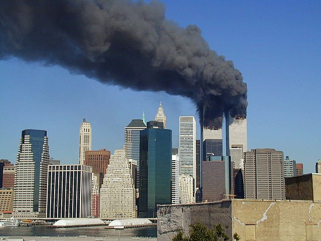 Plumes of smoke billow from the World Trade Center towers in Lower Manhattan, New York City, after a Boeing 767 hits each tower during the September 11 attacks.